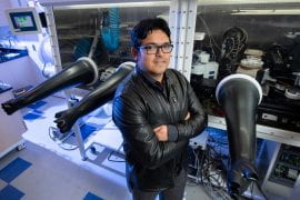 <p>Luis Jauregui, UCI professor of physics &#038; astronomy, stands in his lab where he and his group work to design materials needed for tomorrow’s quantum computers. Steve Zylius / UCI</p>
