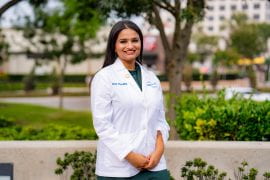 <p>“My white coat will be a daily reminder to uphold the responsibilities that come with the profession of pharmacy and to continue to make my family and community proud through service in this field,” says Sakhi Patel. Christopher Todd Studios</p>
