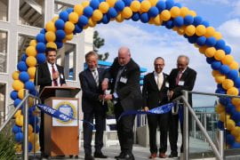 <p>UCI Chancellor Howard Gillman and HORIBA Group Chairman and CEO of HORIBA Ltd. Atsushi Horiba cut a ribbon to formally open the HIMaC2 advanced mobility research center on the UCI campus. They are flanked by (on the left) HIMaC2 Director Vojislav Stamenkovic, UCI professor of chemical and biomolecular engineering; and (on the right) UCI Dean of Engineering Magnus Egerstedt and Jai Hakhu, executive corporate officer for HORIBA Ltd. Lori Brandt / UCI</p>
