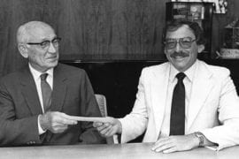 <p>In 1982, businessman and philanthropist Arnold Beckman, left, presents Michael Berns with the first check toward establishing the Beckman Laser Institute &#038; Medical Clinic at UCI. Beckman Laser Institute &#038; Medical Clinic</p>
